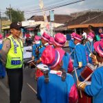Brigadir Ibnu Mobarok melaksanakan pengamanan giat silaturahmi dan drumband anak anak di Desa Pendem Junrejo